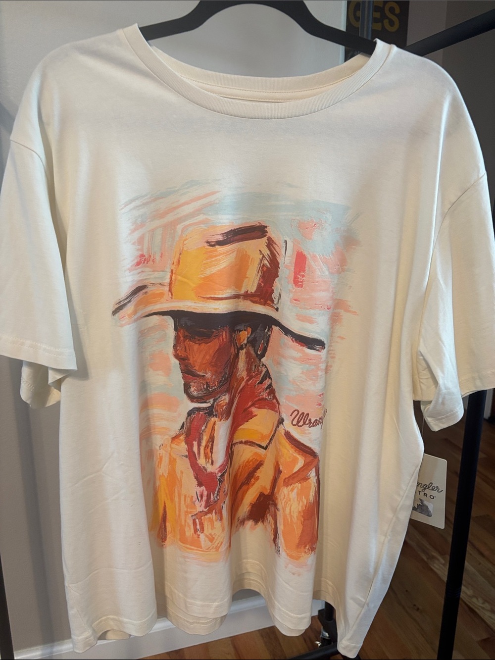 Wrangler Cream Short-Sleeve Tee with Orange Cowboy Graphic